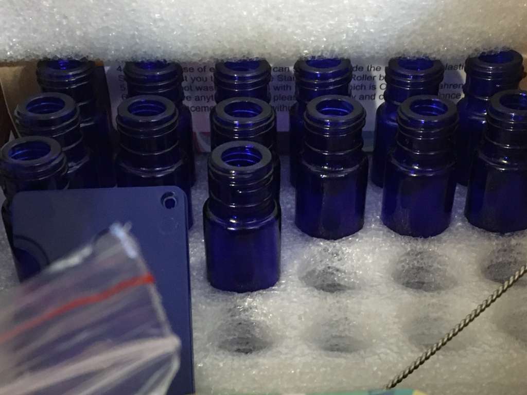 Empty rollerball bottles ready for cannabis topical oil.