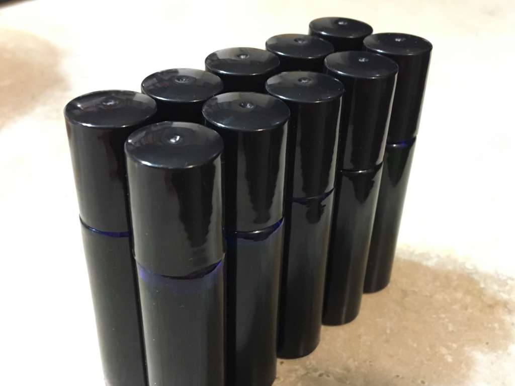 Rollerball bottles for cannabis topical oils.