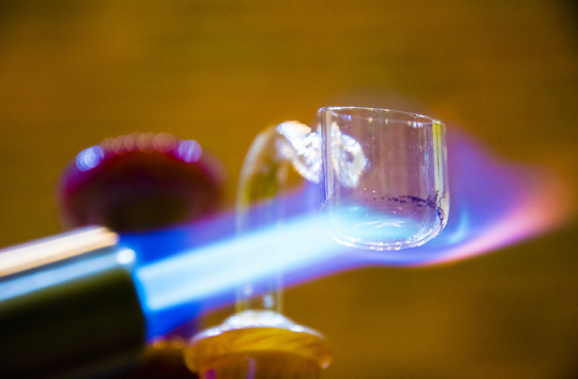 A glass banger heated by a torch.